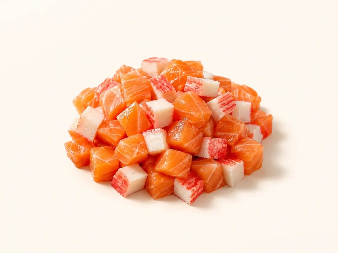 Cubes of raw salmon mixed with shredded kanikama